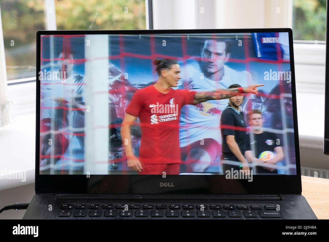 Darwin Nunez celebrates scoring a goal in the Liverpool FC 5-0 win vs RB Leipzig in the July 21 2022 pre season friendly on LFC TV on a laptop screen Stock Photo