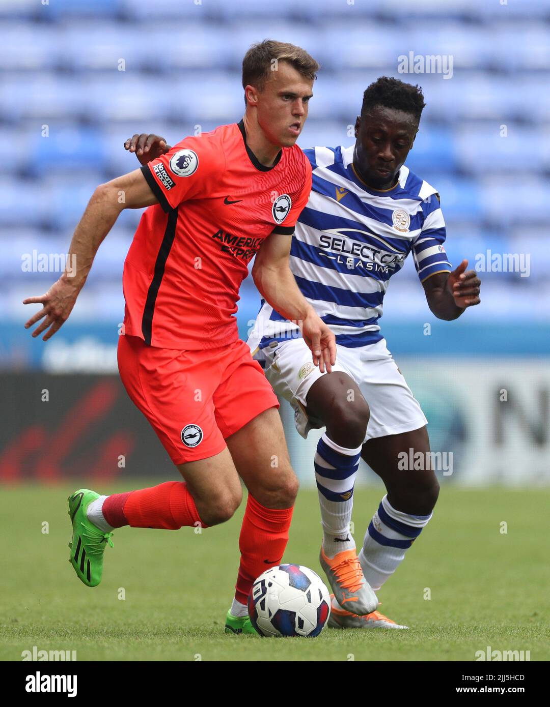 Brighton and Hove Albion's Solly March (left) and Reading's Andy Yiadom battle for the ball during a pre-season friendly match at Select Car Leasing Stadium, Reading. Picture date: Saturday July 23, 2022. Stock Photo