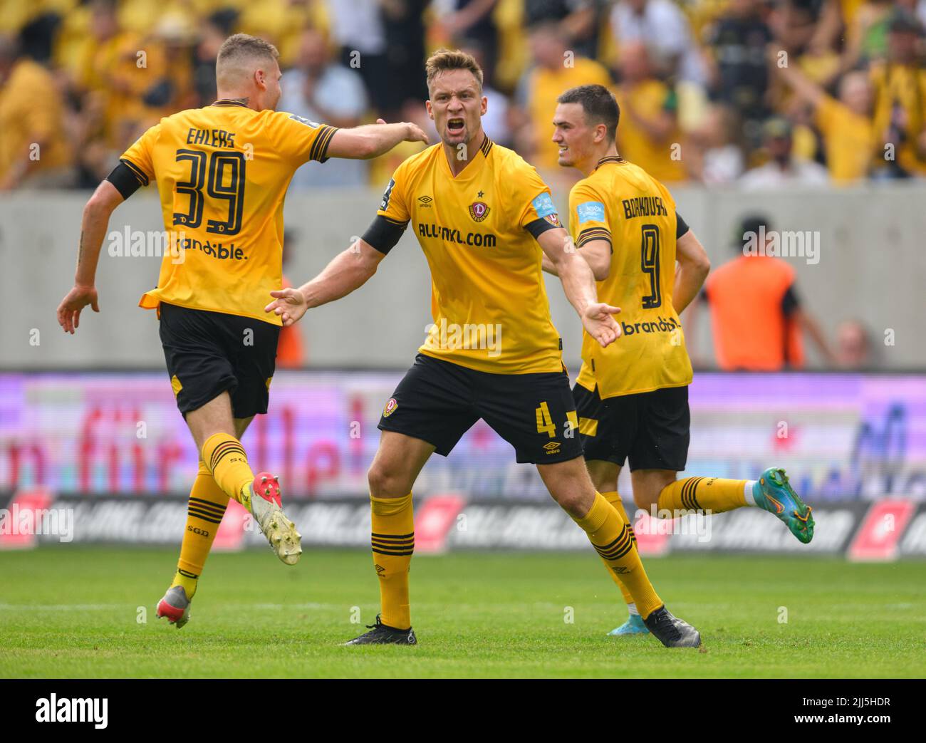 Dresden, Germany. 23rd July, 2022. Soccer: 3rd league, SG Dynamo Dresden - TSV  1860 Munich, Matchday 1, Rudolf Harbig Stadium. Dynamo's Kevin Ehlers  (l-r), Tim Knipping and Dennis Borkowski emotional. Credit: Robert