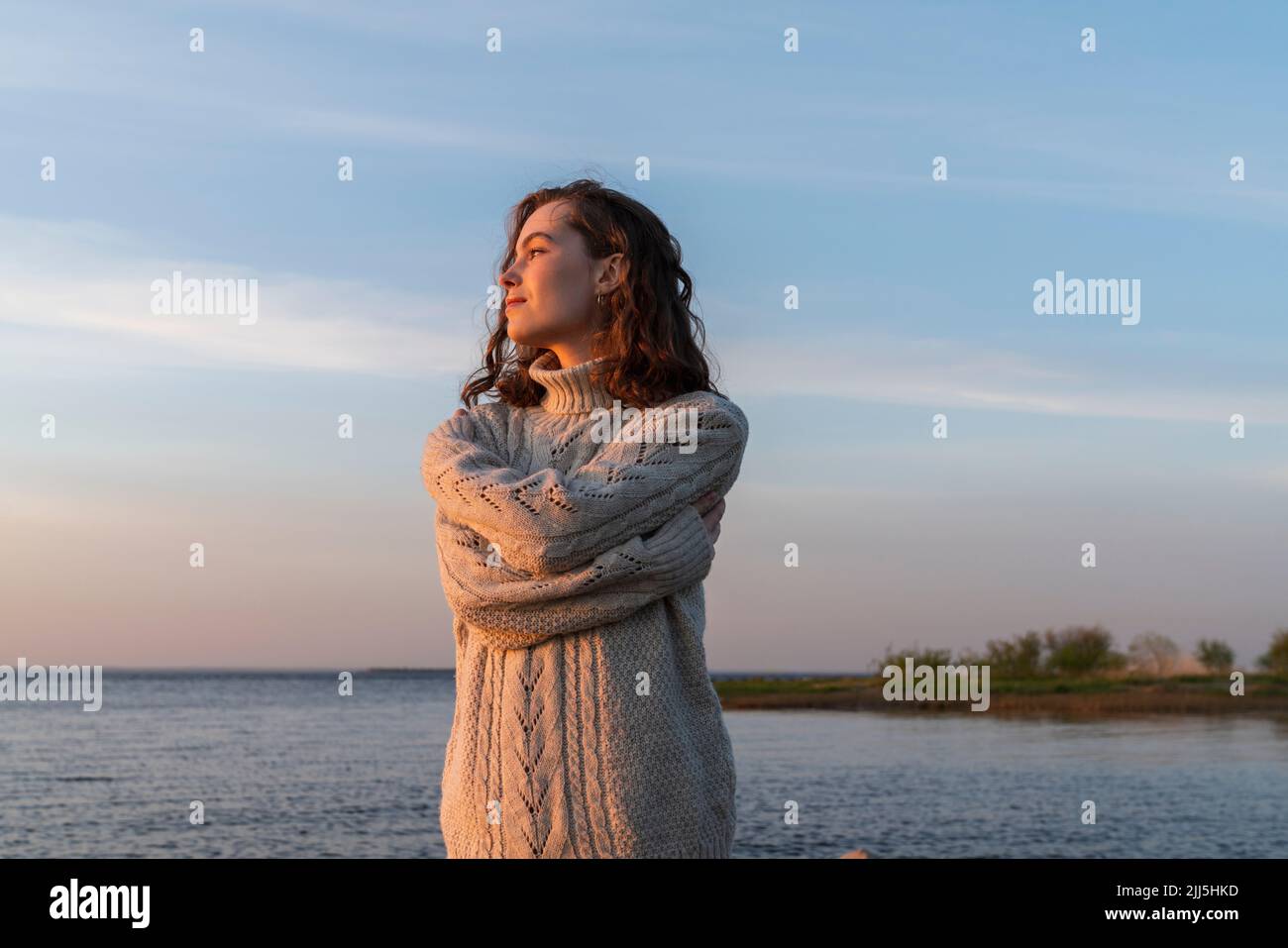 Woman arms crossed hugging hi-res stock photography and images - Alamy