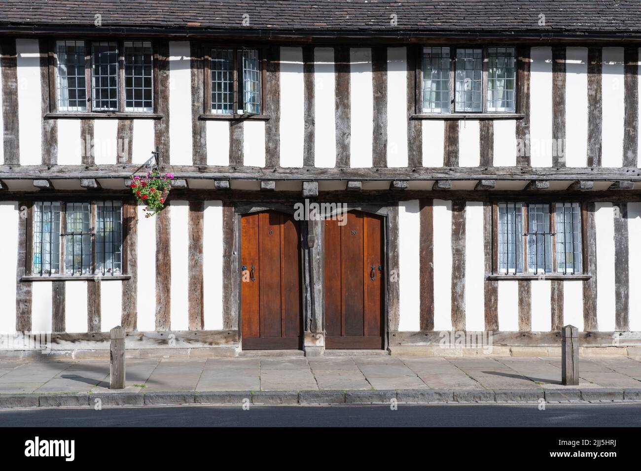 Closeup view on the Grade I (1) Listed Almshouses, jettied timber framed buildings with plaster infill on Church Street. Stratford Upon Avon, UK Stock Photo