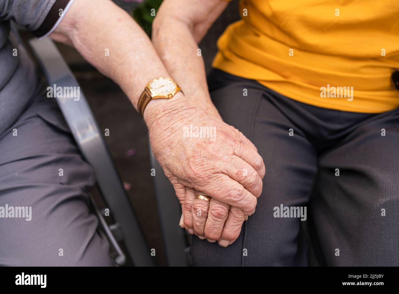 Senior couple holding hands Stock Photo