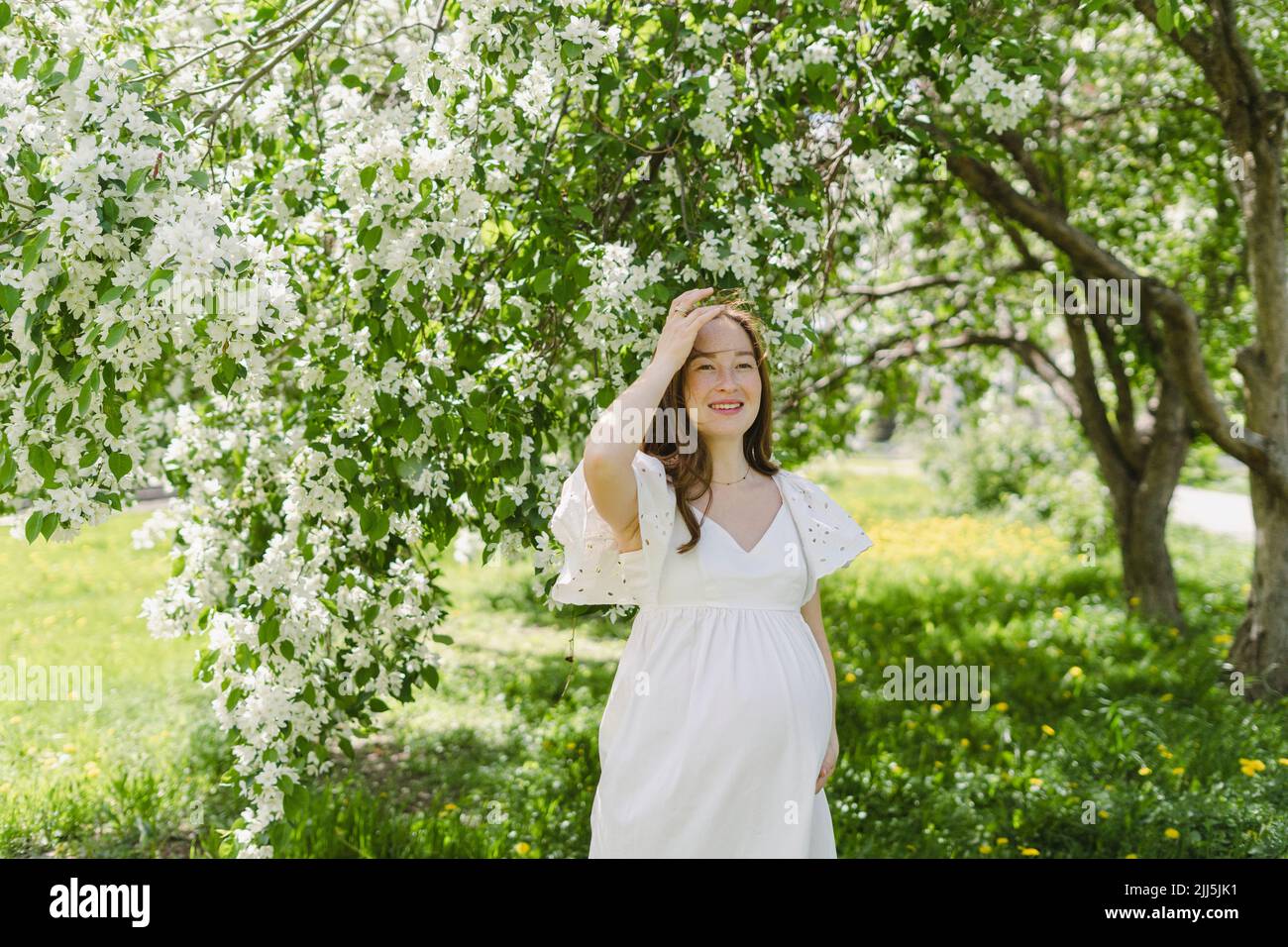 Pregnant woman raising hands in hi-res stock photography and images - Alamy