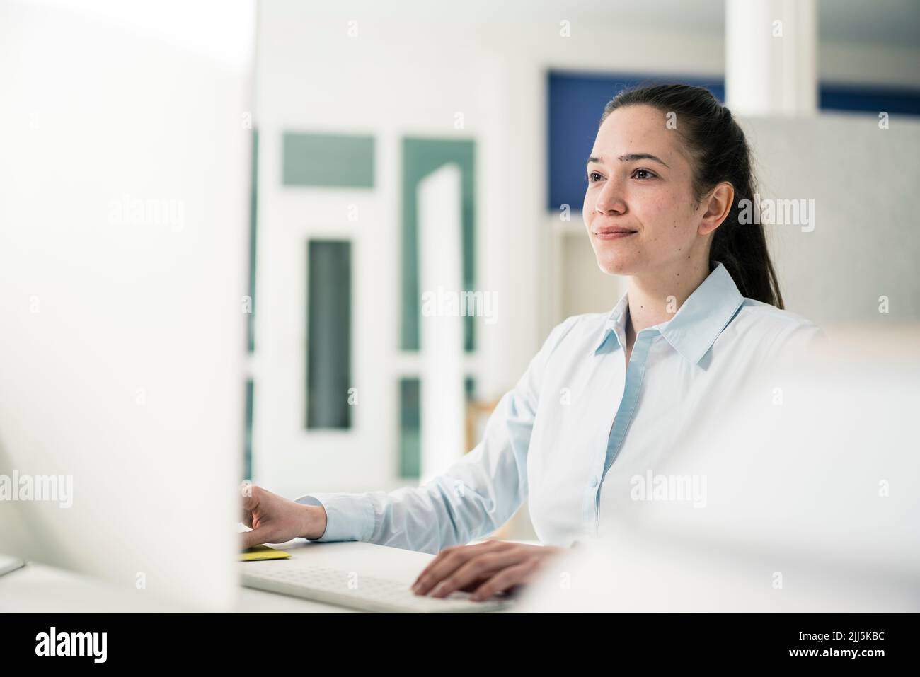 Businesswoman working on computer at office Stock Photo