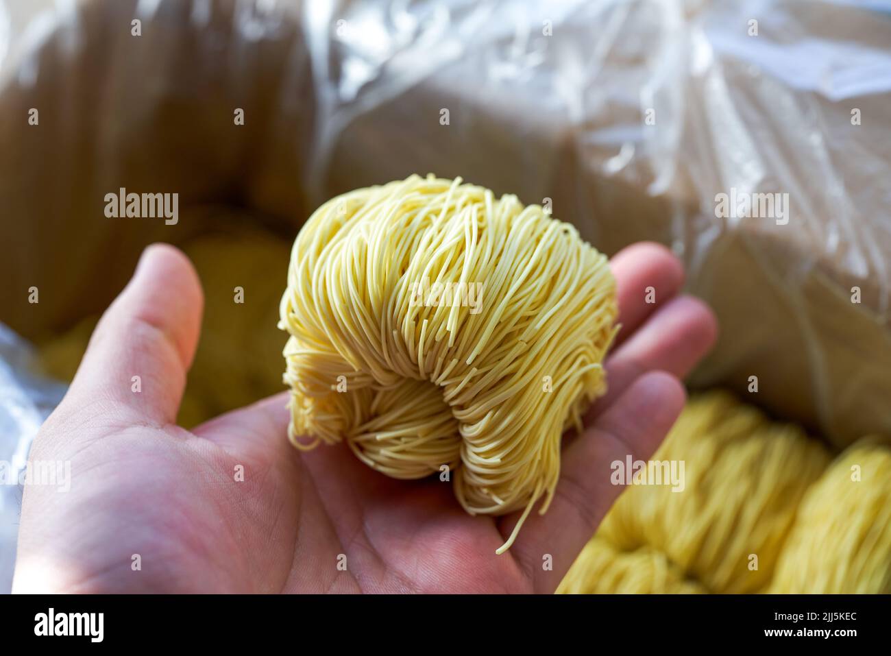 Pile of slender Cantonese style bamboo noodles dough Stock Photo Alamy