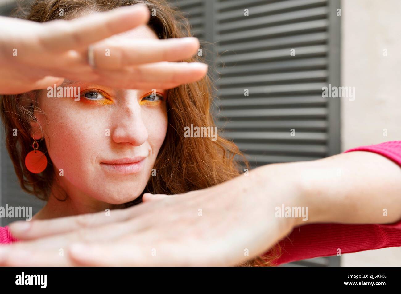 Beautiful woman making hand frame Stock Photo Alamy