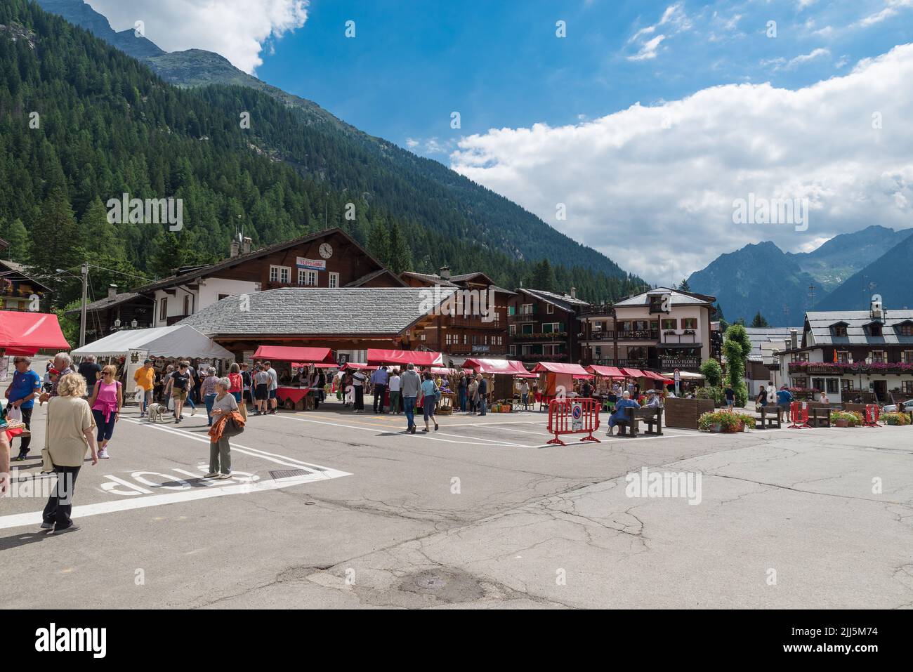 Mountain culture and tradition. San Bernardo fair, an important summer festival with stalls and alpine handicraft products. Main square of Macugnaga Stock Photo