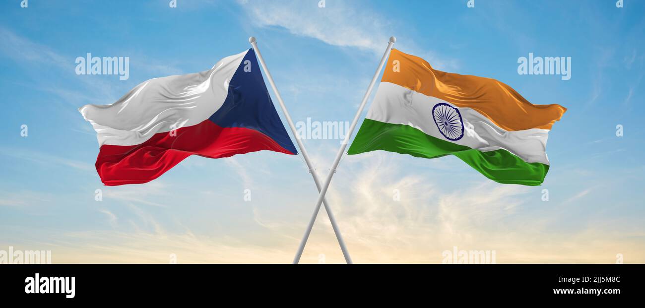 two crossed flags India and Czech republic waving in wind at cloudy sky ...