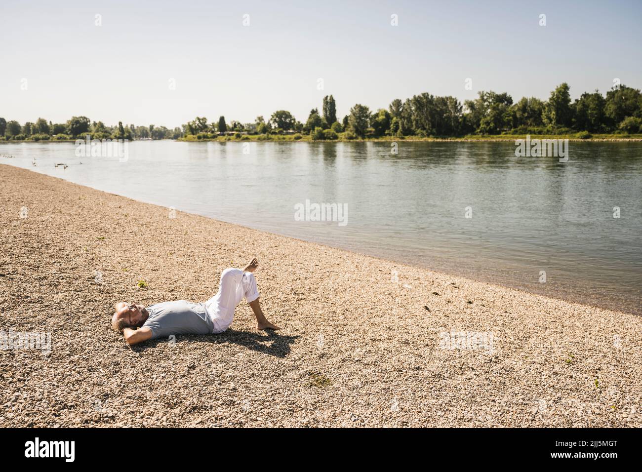 Old man hands behind back hi-res stock photography and images - Alamy