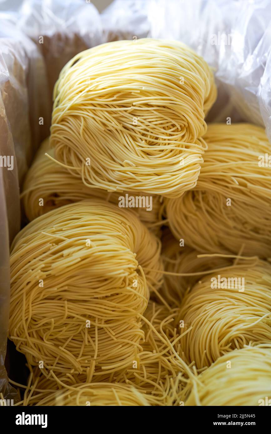 Pile of slender Cantonese style bamboo noodles dough Stock Photo Alamy