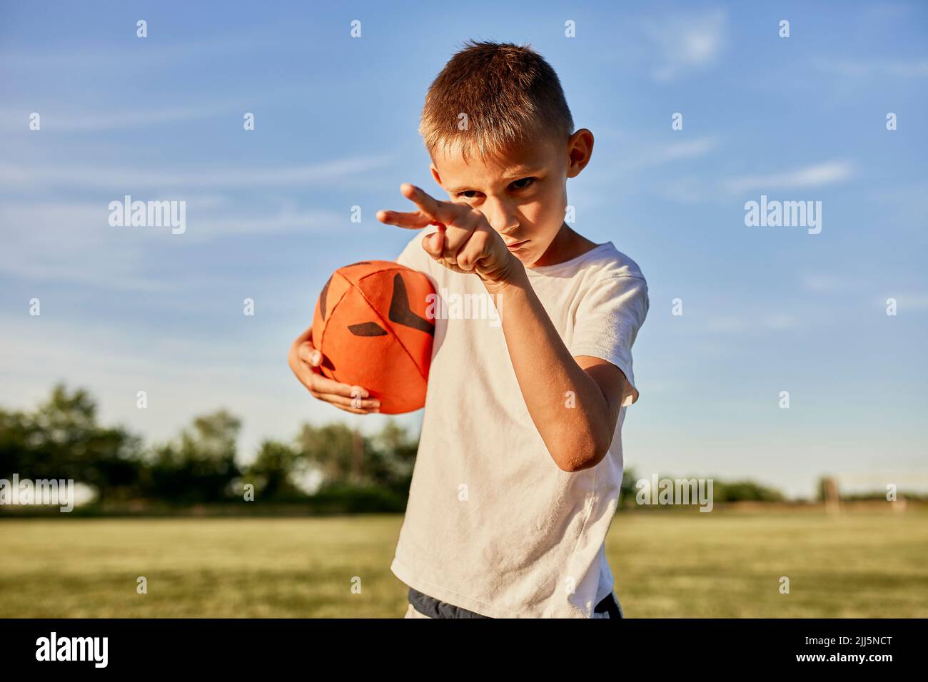 Boy holding rugby ball hires stock photography and images Alamy