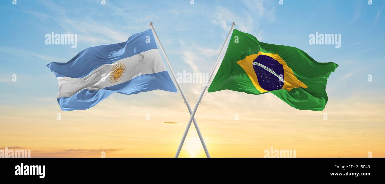 crossed national flags of Argentine and Brazil flag waving in wind at ...