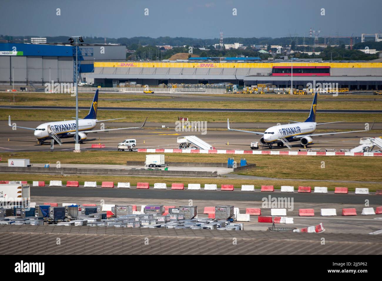 Brussels, Belgium. 23rd July, 2022. Illustration picture shows Ryanair planes on the tarmac of the departure hall of Brussels Airport, in Zaventem, Saturday 23 July 2022.  Some 80 flights have been cancelled in Belgium. It concerns flights with a Belgian crew. The other flights depart with a crew from countries where there is no strike. The reasons for this weekend's strike are the same as those for the action at the end of June. The pilots feel misunderstood and expect a pay increase after a 20 percent surrender during the corona crisis. BELGA PHOTO NICOLAS MAETERLINCK Credit: Belga News Agen Stock Photo