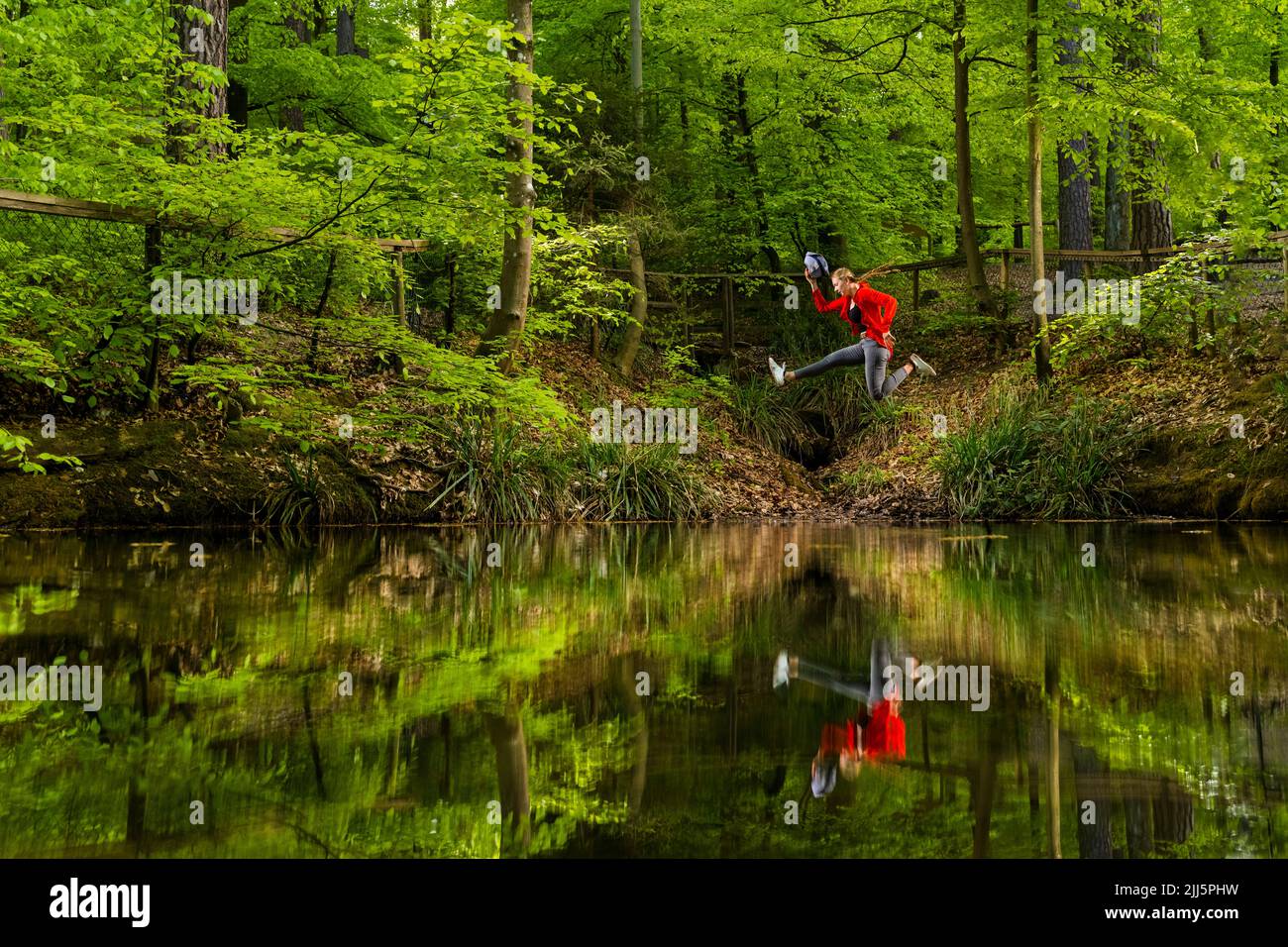 Woman jumps lake hi-res stock photography and images - Alamy