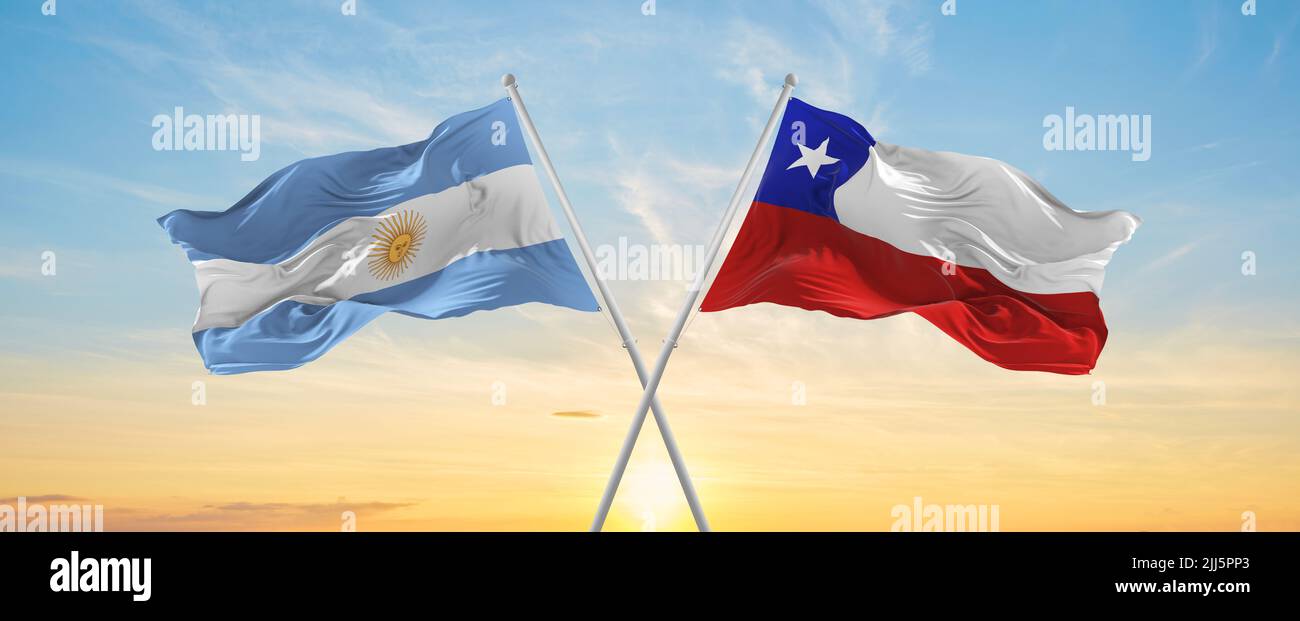 crossed national flags of Argentine and Chile flag waving in wind at ...