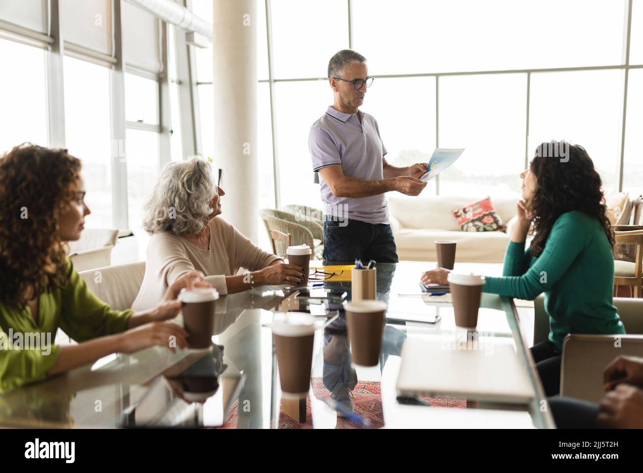 Seated woman in office meeting hi-res stock photography and images - Alamy
