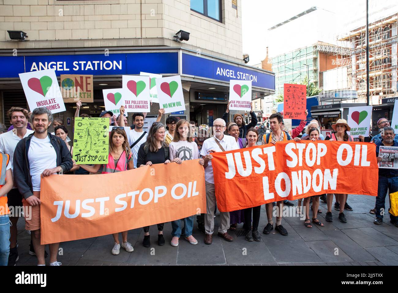 London, UK. 23rd July 2022. We All Want To Just Stop Oil Coalition: National March & Sit Down. Jeremy Corbyn joined the march at Angel tube, pictured here behind a Just Stop Oil London banner. One of many marches converging upon Westminster. Credit: Stephen Bell/Alamy Live News Stock Photo