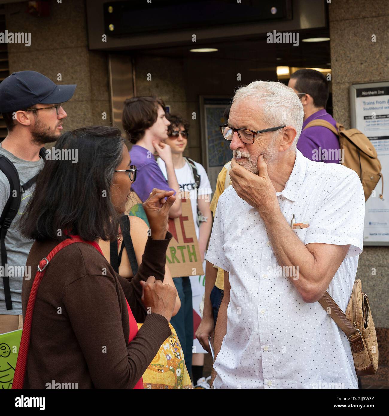 London, UK. 23rd July 2022. We All Want To Just Stop Oil Coalition: National March & Sit Down. Jeremy Corbyn joined the march at Angel tube and pictured here in discussion. Credit: Stephen Bell/Alamy Live News Stock Photo
