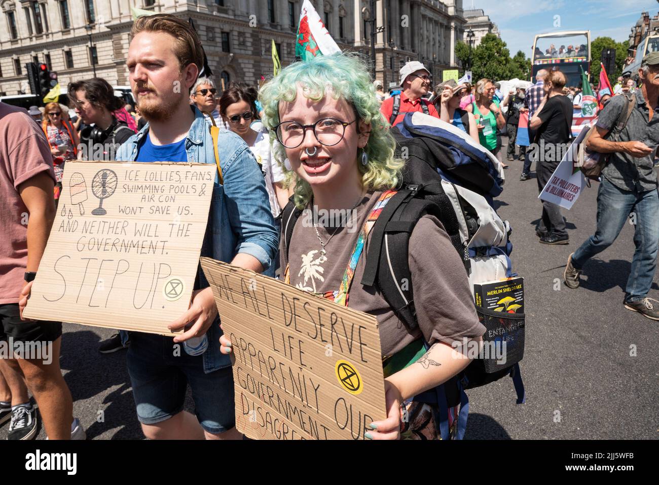 London, UK. 23rd July 2022. We All Want To Just Stop Oil Coalition: National March & Sit Down. One of many marches converging upon Westminster. Protesters holding placards in Parliament Square. Credit: Stephen Bell/Alamy Live News Stock Photo