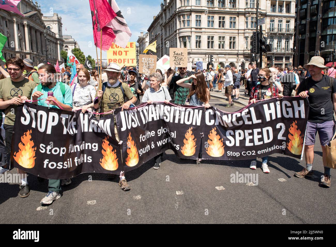 London, UK. 23rd July 2022. We All Want To Just Stop Oil Coalition: National March & Sit Down. One of many marches converging upon Westminster. Marchers approaching Parliament Square behind banner. Credit: Stephen Bell/Alamy Live News Stock Photo
