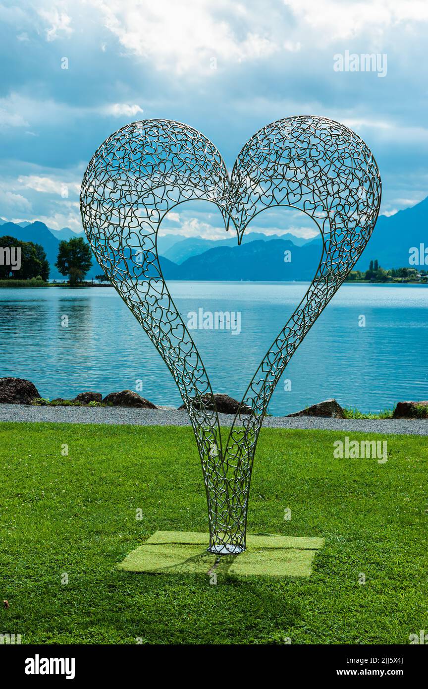 Kussnacht am Rigi, Switzerland - July 7, 2022: Metal heart sculpture at the shores of Lake Lucerne in Kussnacht am Rigi in Switzerland Stock Photo