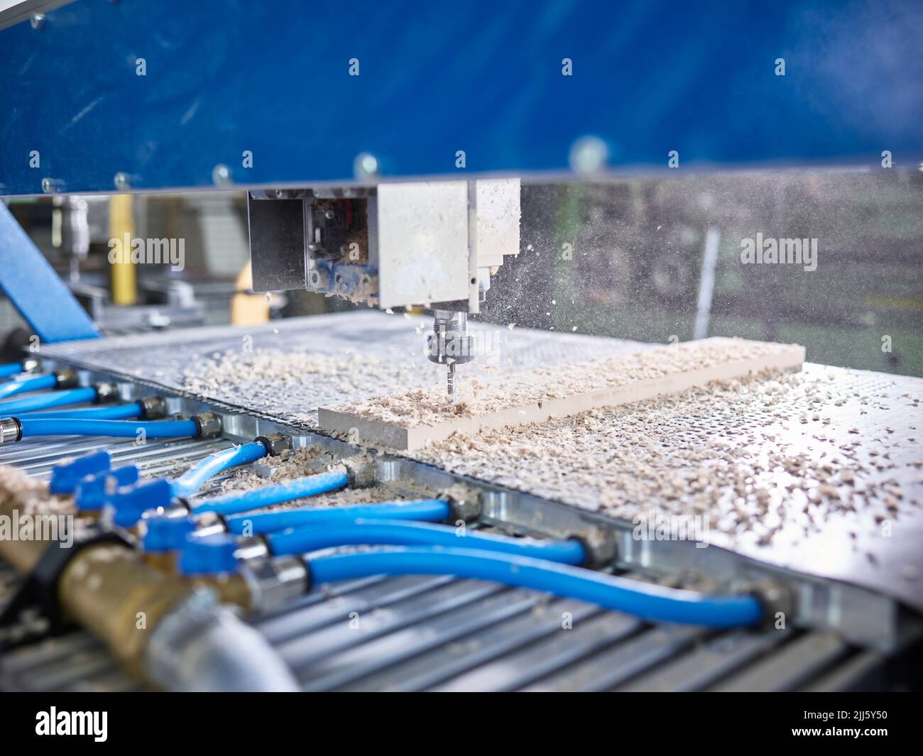 CNC machine cutting wooden plank in factory Stock Photo Alamy