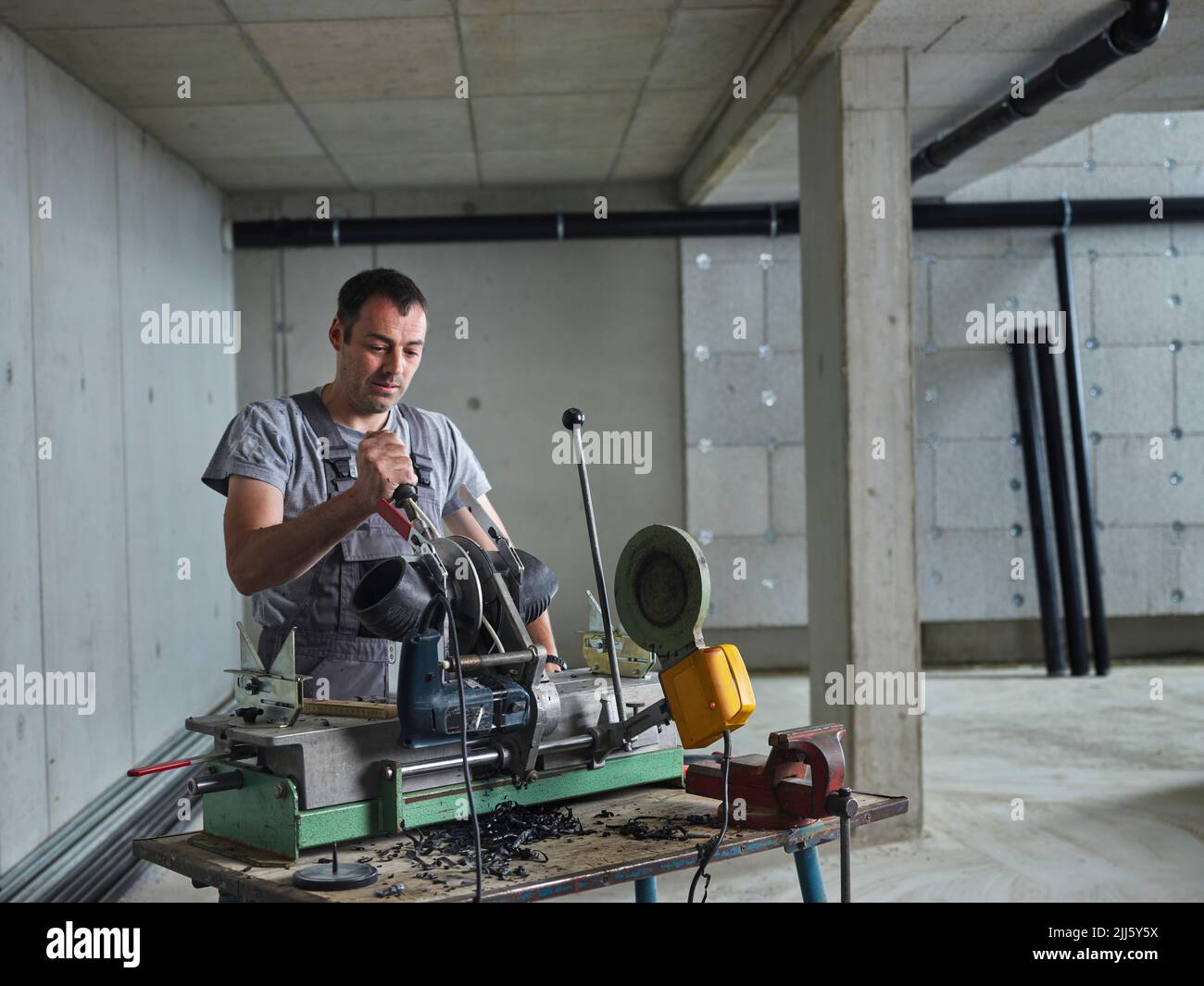 Mature plumber working at construction site Stock Photo