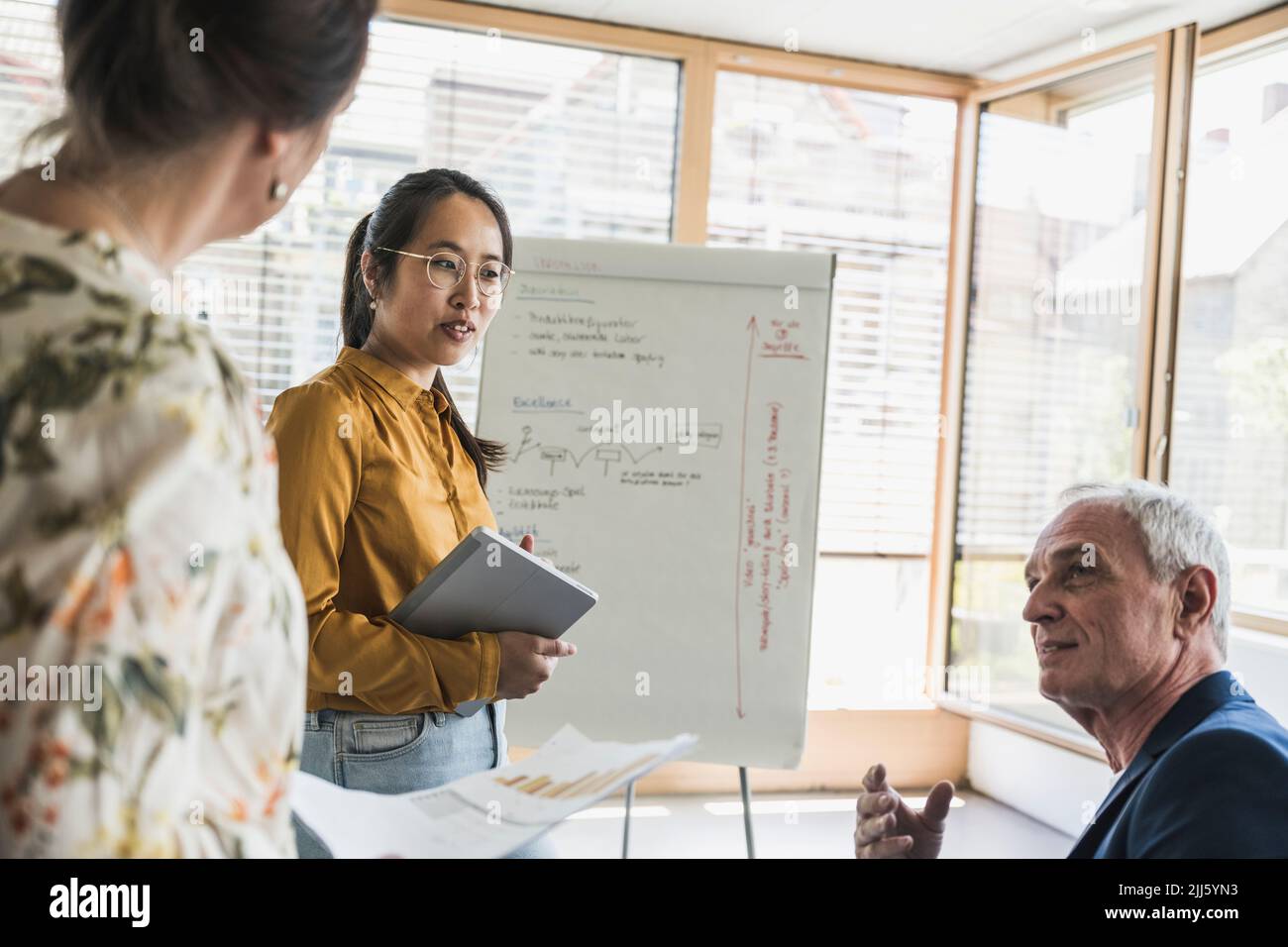 Business colleagues having meeting at work place Stock Photo