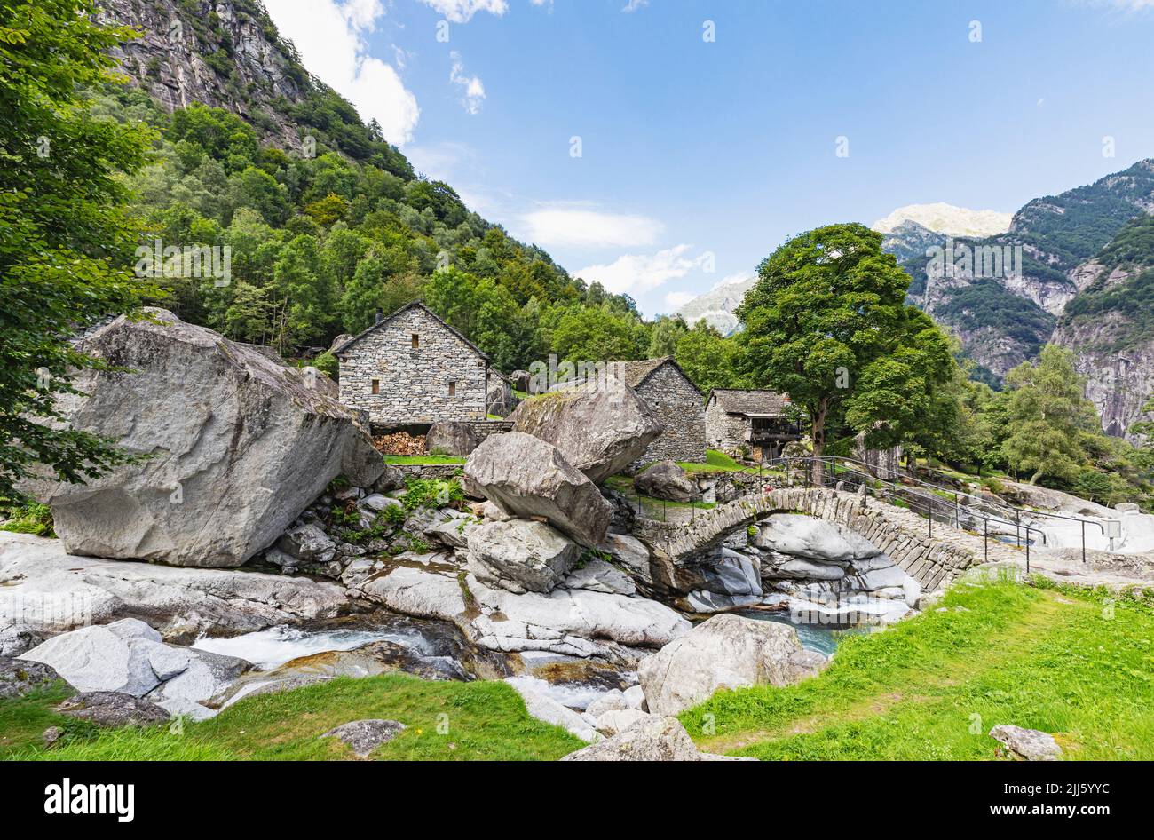 Boulders by bridge in valley Stock Photo