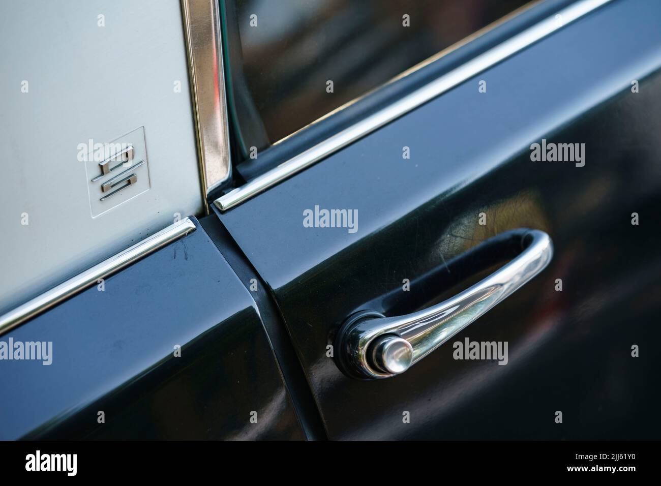 Detail of the door handle of a Citroen DS classic car from french manufacturer Citroën Stock Photo