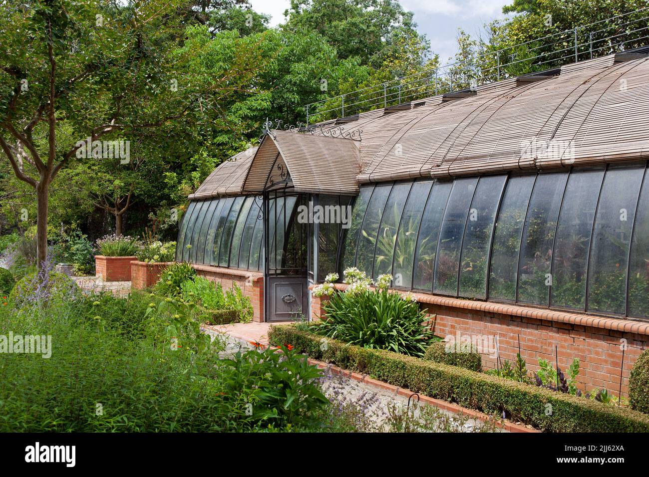 Vintage greenhouse in a French park in Spring Stock Photo