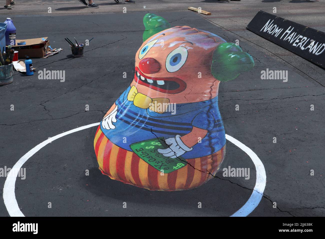 Sidewalk Chalk Art: Clown Punching Bag in 3D Stock Photo