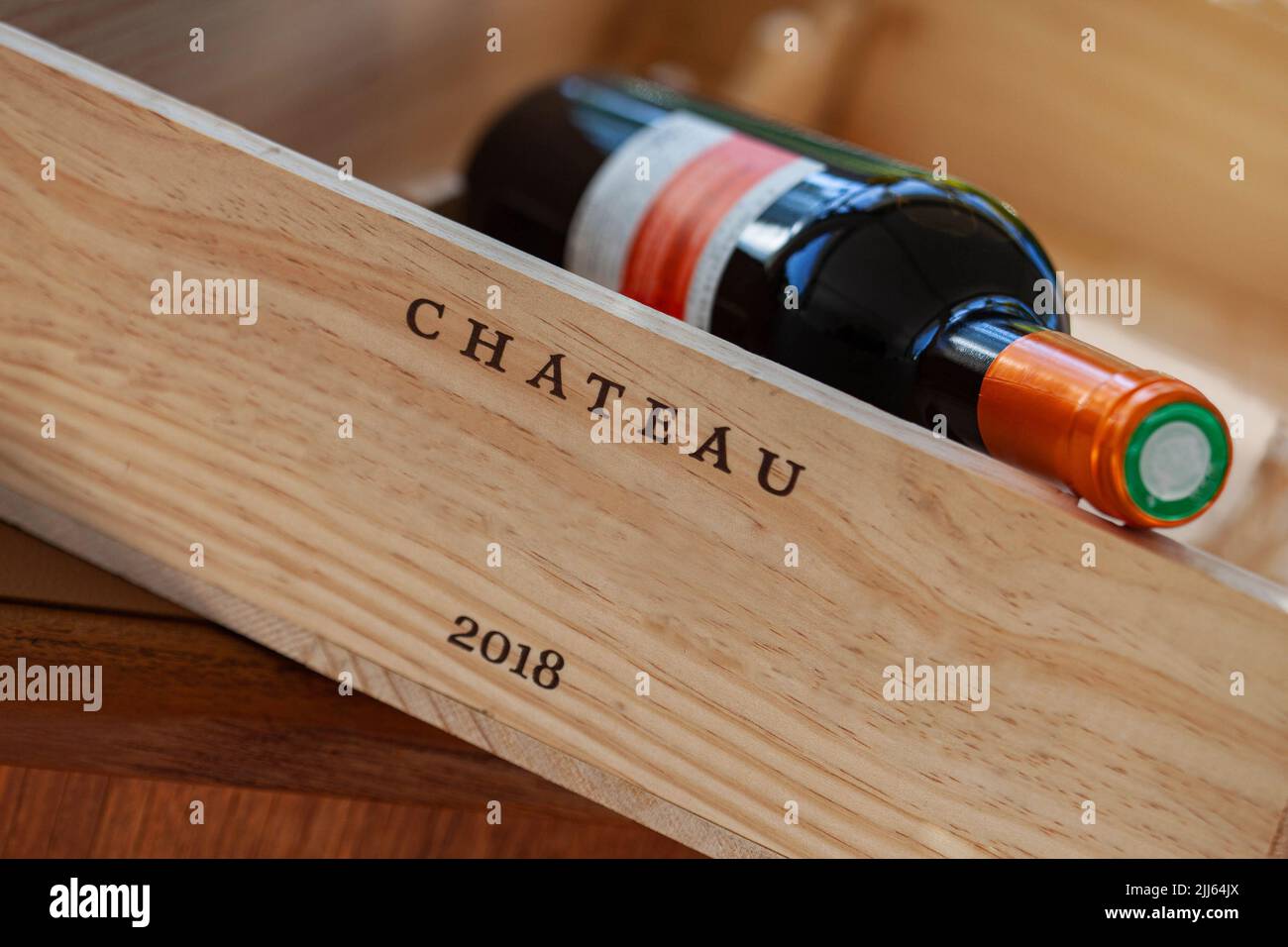 Wine bottle in a wooden box Stock Photo