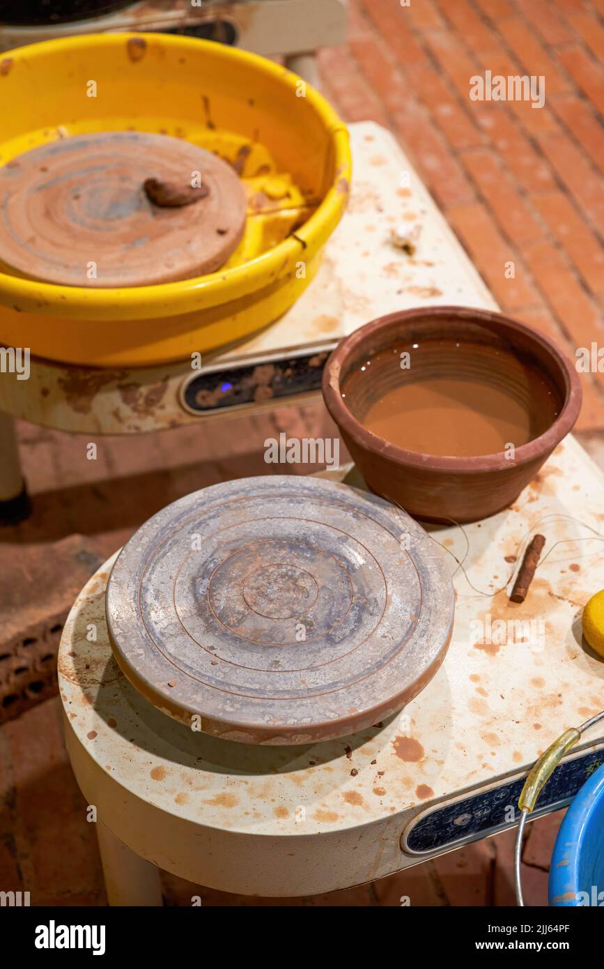 Turntable equipment for making pottery in pottery shop Stock Photo Alamy