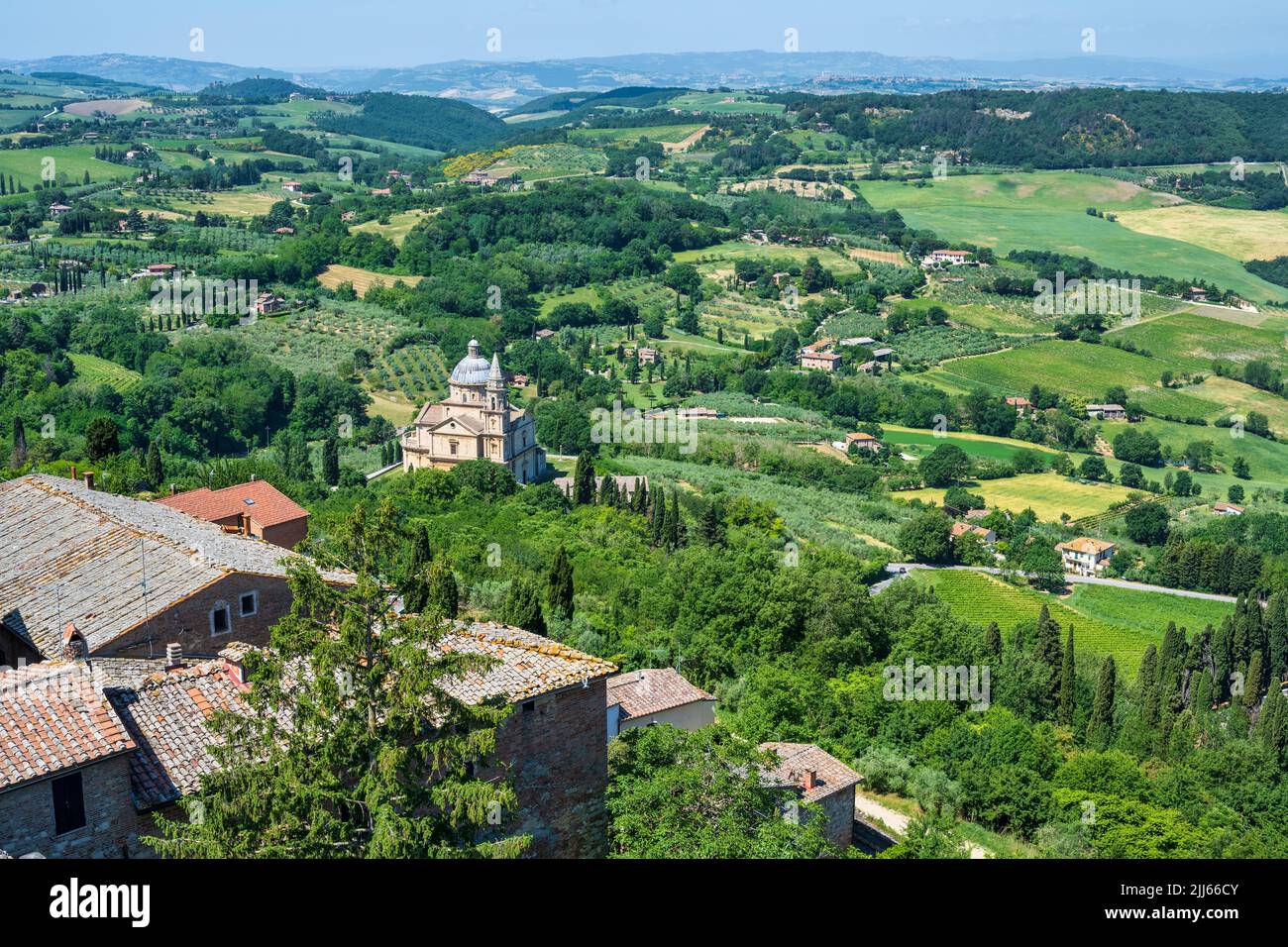 View of the Sanctuary of San Biagio (Tempio di San Biagio) with the rolling Tuscan countryside beyond, from Montepulciano in Tuscany, Italy Stock Photo