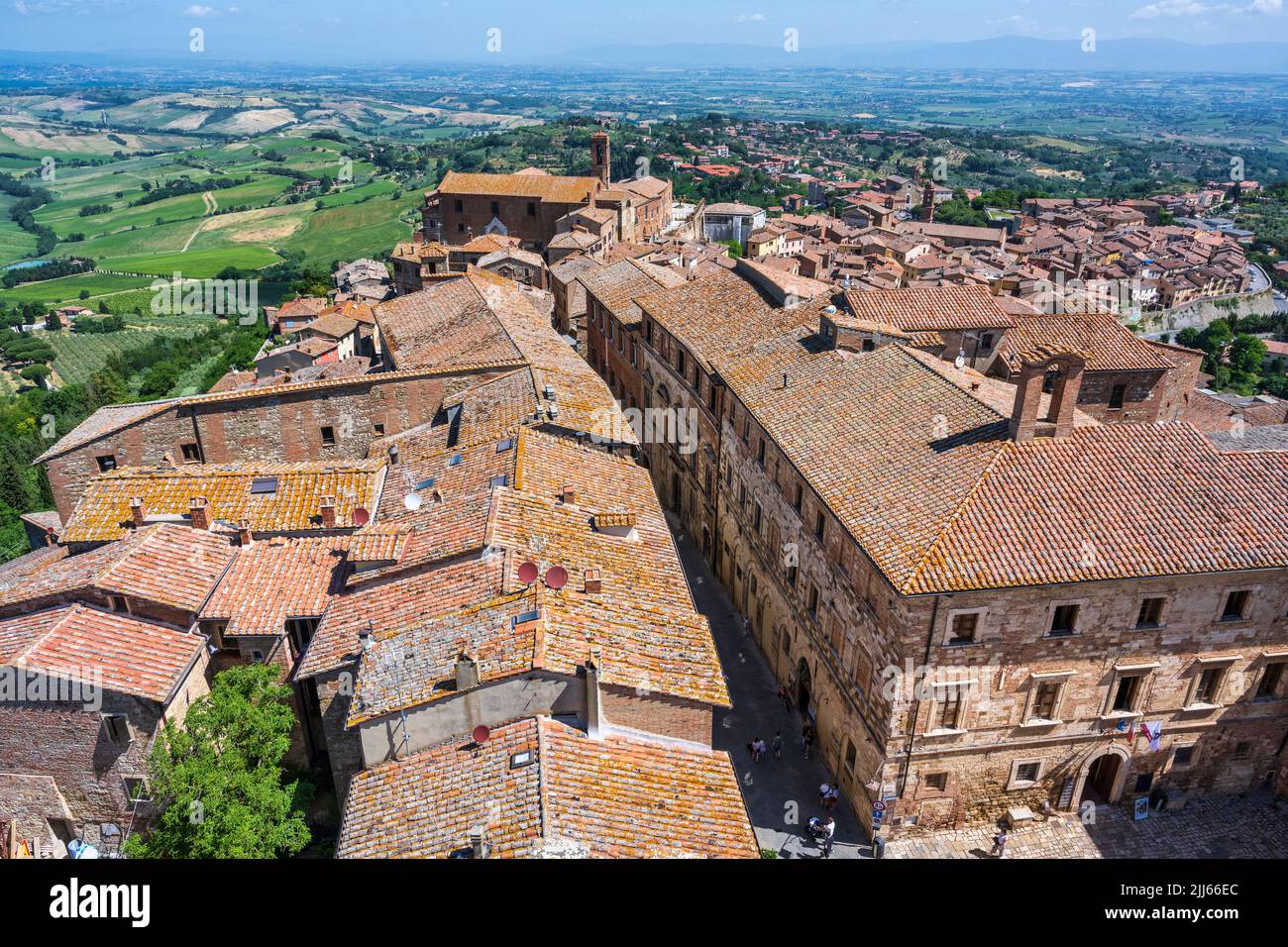 View across rooftops looking down Via Ricci to the lower town in the hilltop town of Montepulciano in Tuscany, Italy Stock Photo