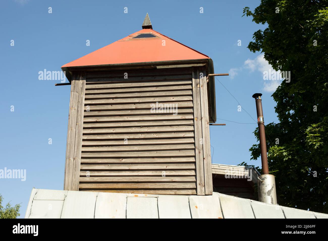 Roof of house in village. Ledge on roof. Architecture details. Wooden