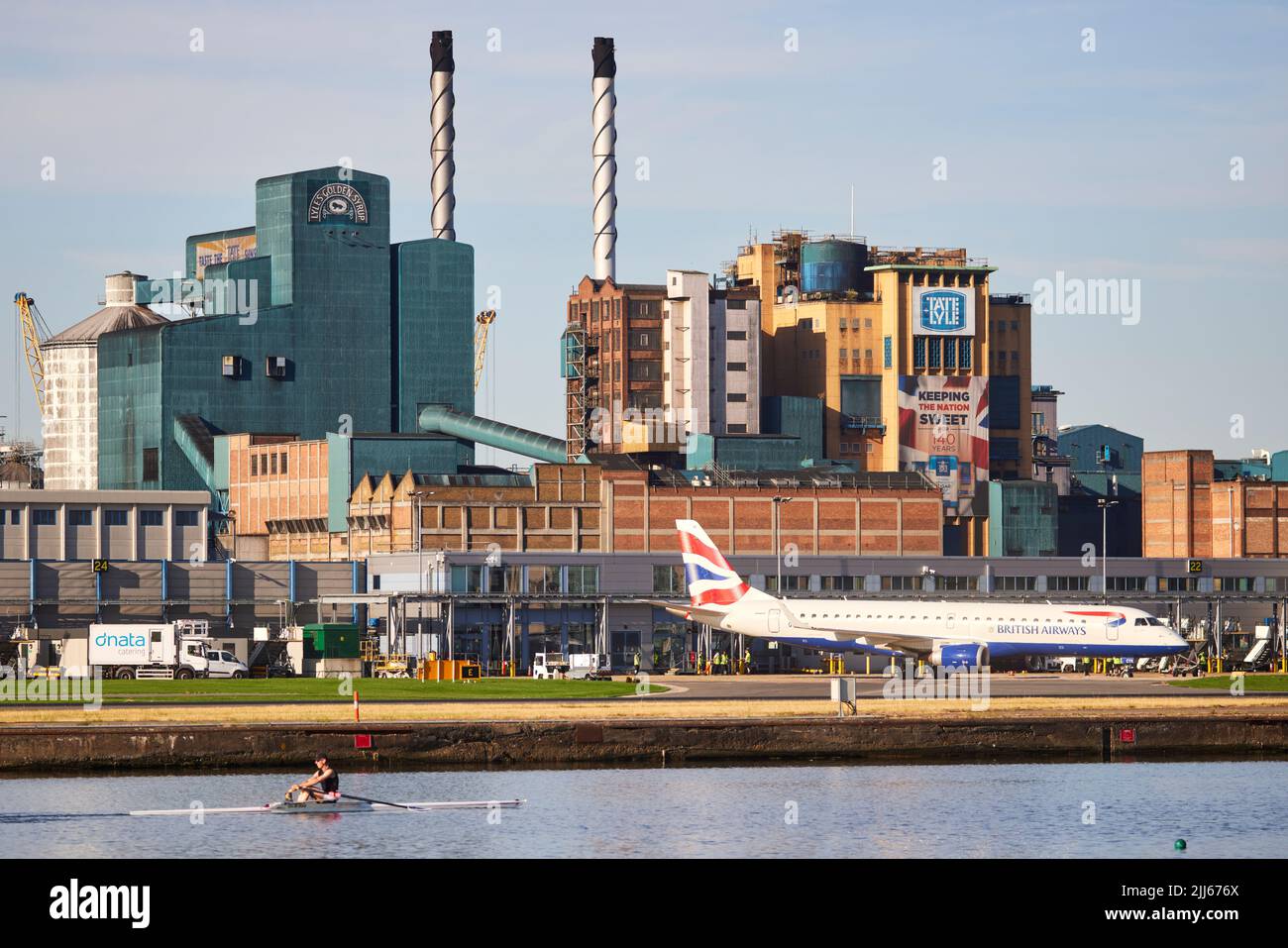 London Royal Albert Dock in Docklands across to London City Airport and Tate & Lyle Sugars Golden factory for Golden Syrup Stock Photo