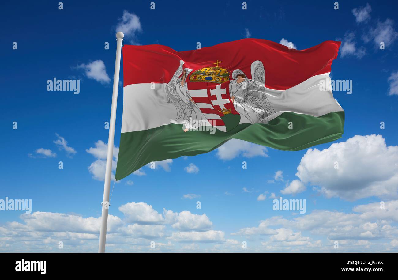 official flag of Hungary 1915 1918 Austria at cloudy sky background on sunset, panoramic view. Austrian travel and patriot concept. copy space for wid Stock Photo