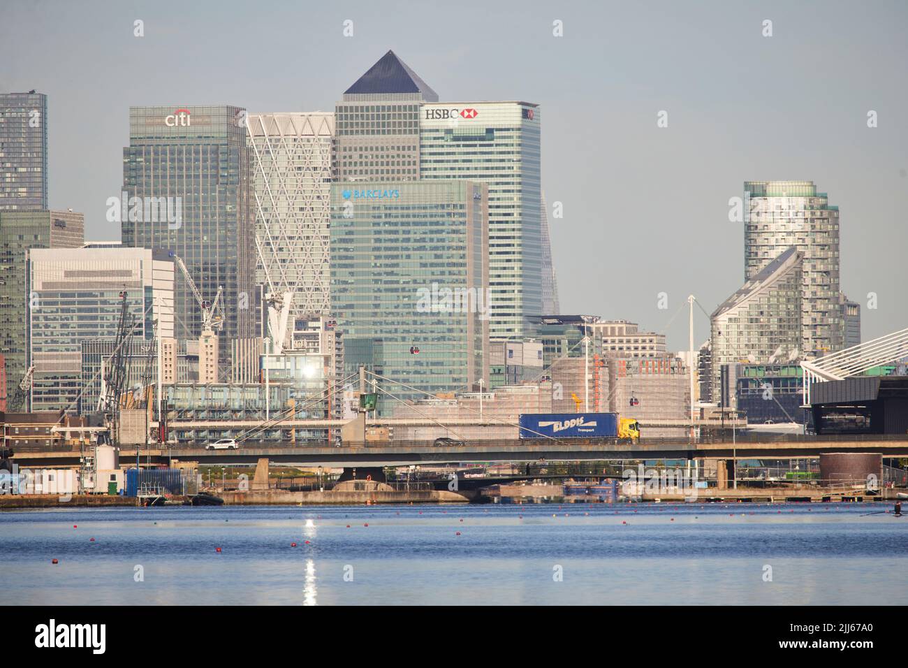 London Royal Albert Dock in Docklands area looking towards the business skyline of Canary Wharf Stock Photo