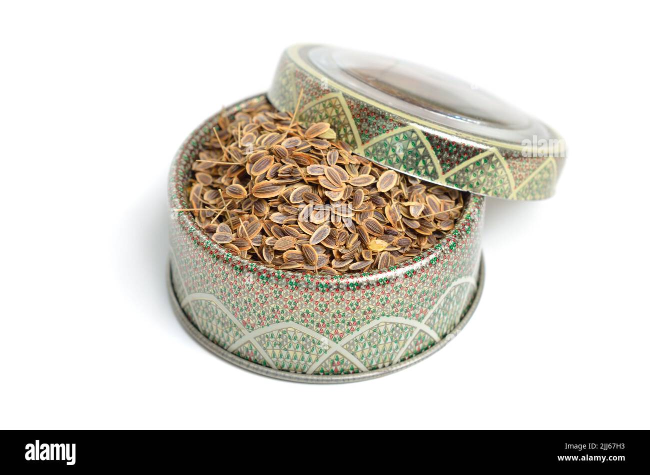 Stack of Dill seeds isolated on white background. Stock Photo