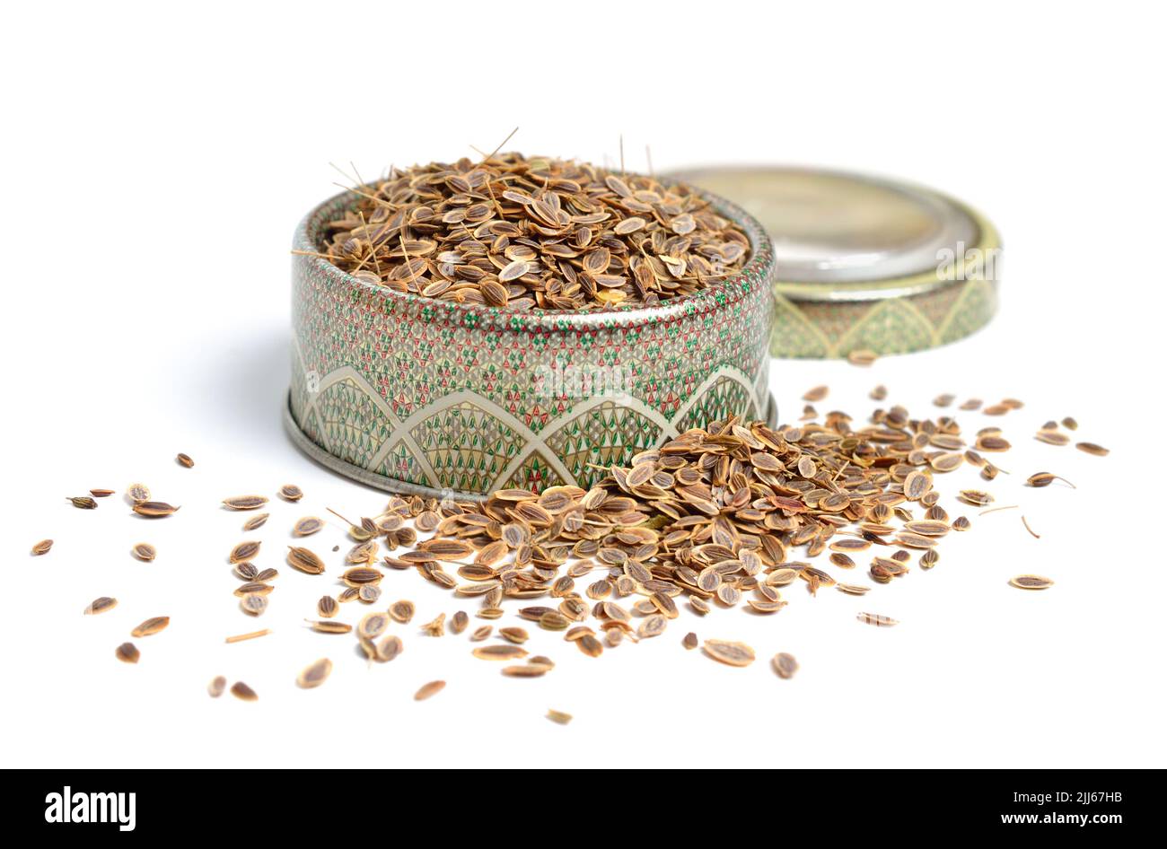 Stack of Dill seeds isolated on white background. Stock Photo