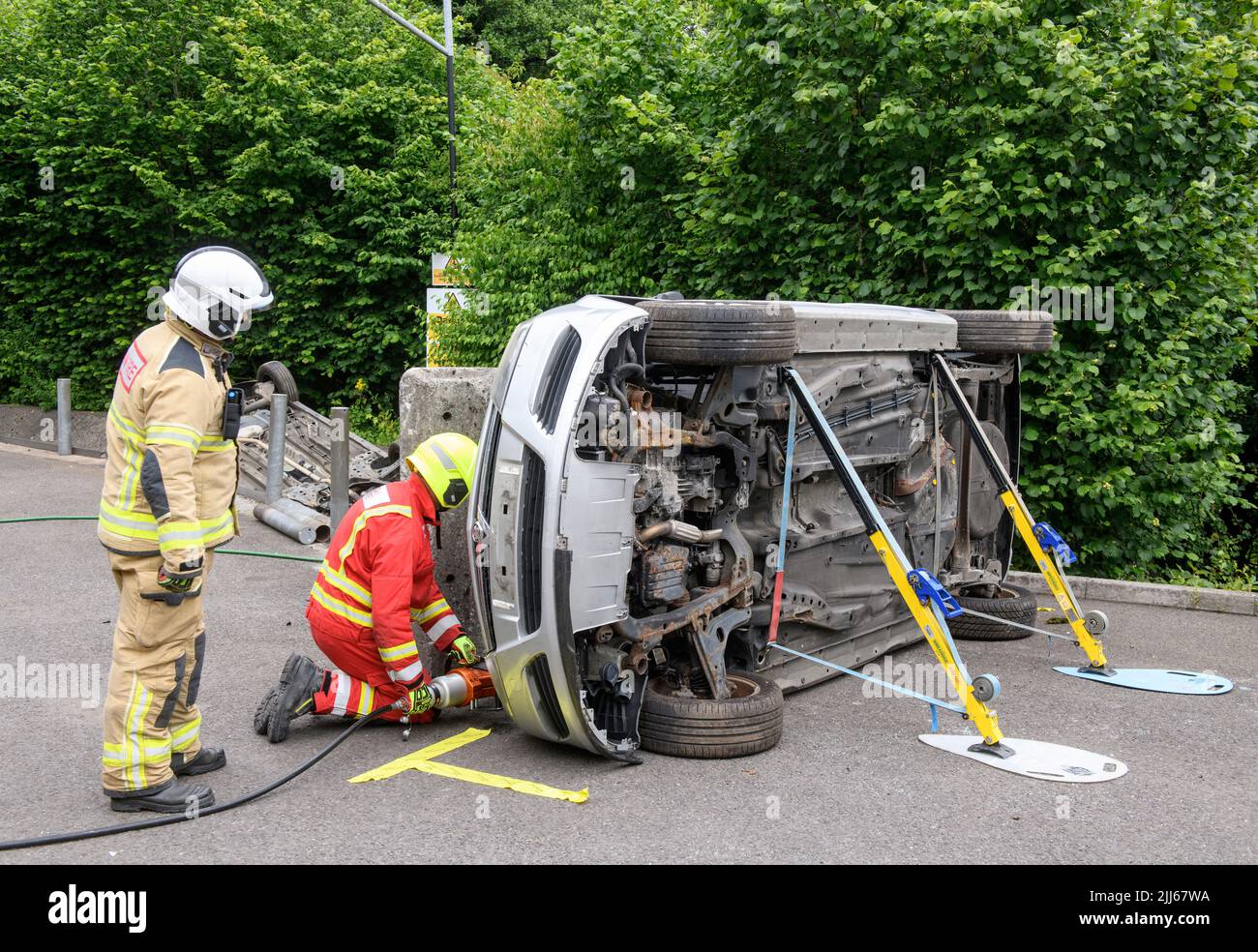 Firefighters use specialist equipment to move a car containing sensors away from an obstruction at Cardiff Gate Training Centre - data gathered will c Stock Photo