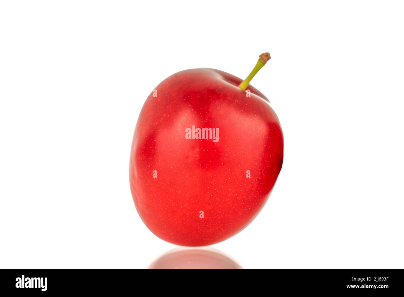 One organic juicy cherry plum, close up, isolated on white background. Stock Photo