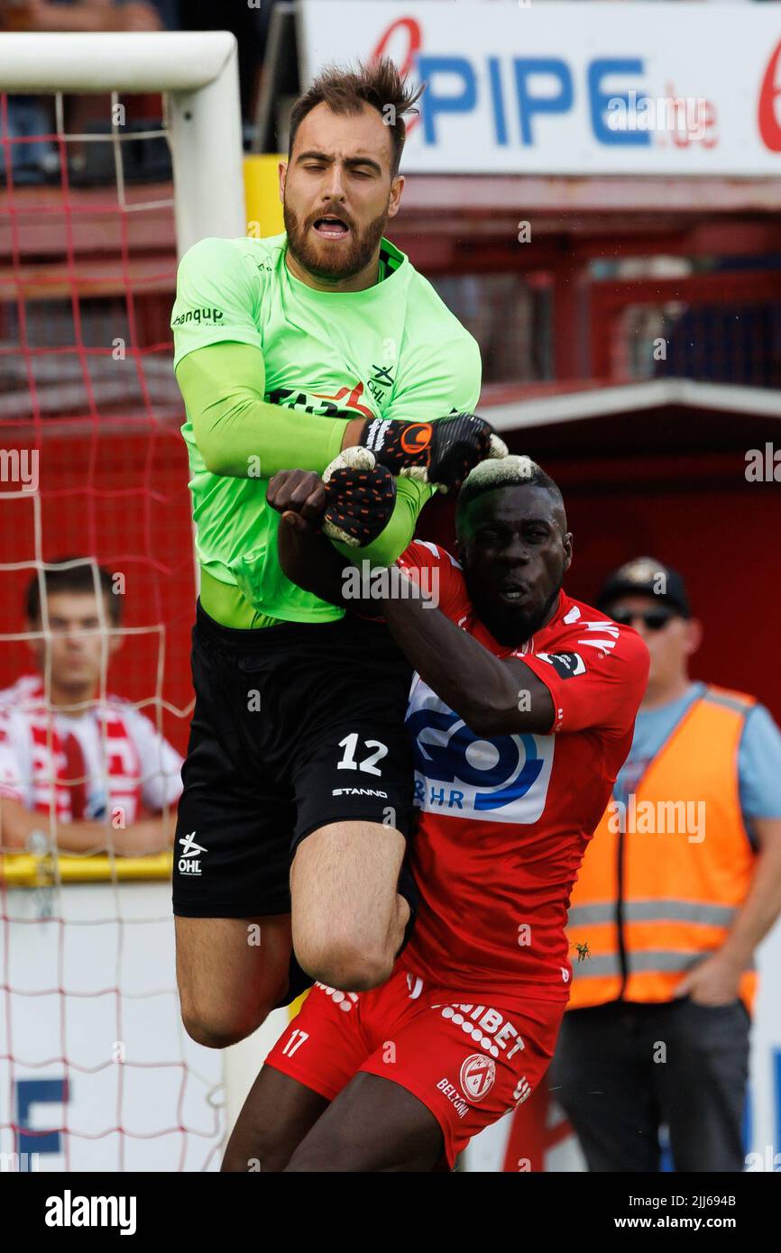 OHL's Valentin Cojocaru and Kortrijk's Pape Habib Gueye fight for the ball during a soccer match