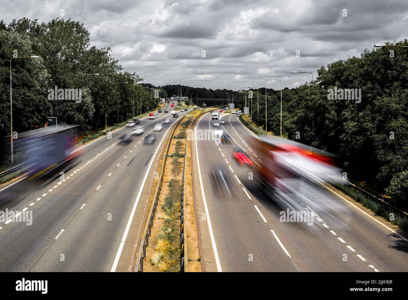 Cars and lorries drive in busy road traffic Stock Photo Alamy