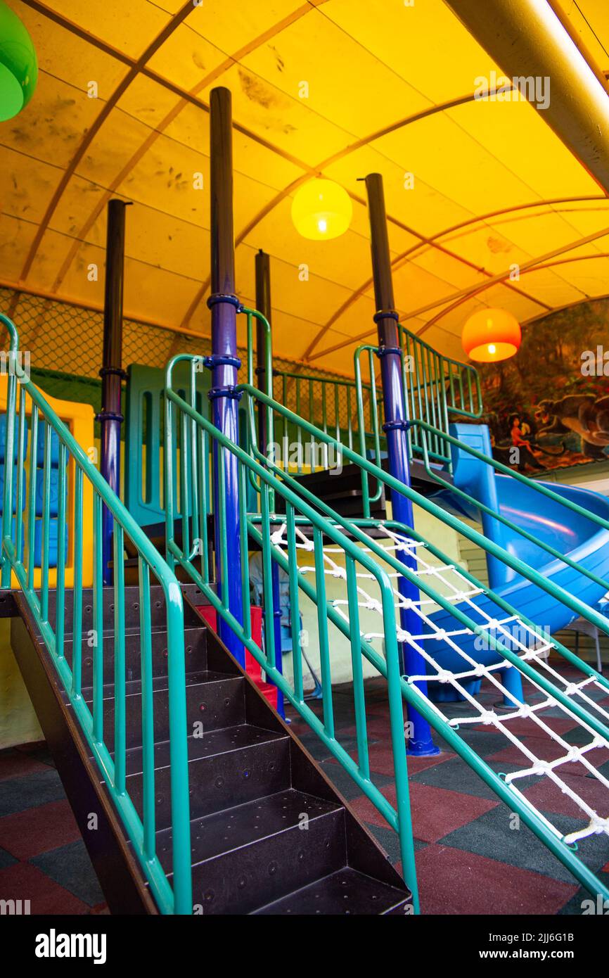 playground with slides and swings in summer on the street Stock Photo
