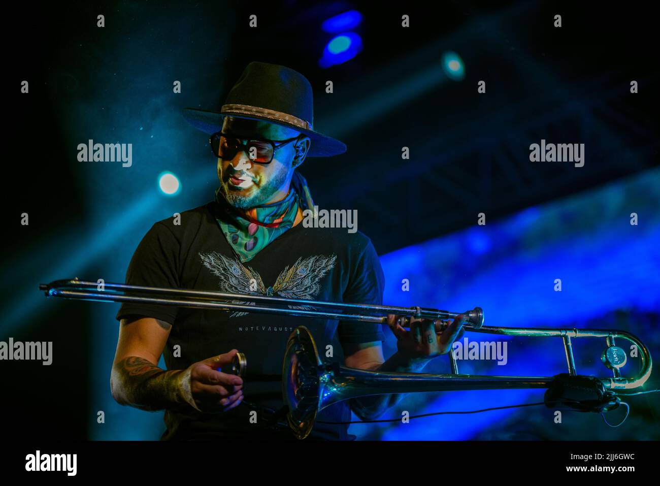 Denis Silveira plays his trombone during No te Va a Gustar rock band concert in Corrientes, Capital. Stock Photo