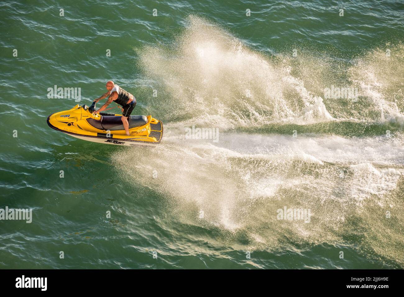 Male driving a Kawasaki 900STX jetsky in the Solent off Southampton, England. Stock Photo