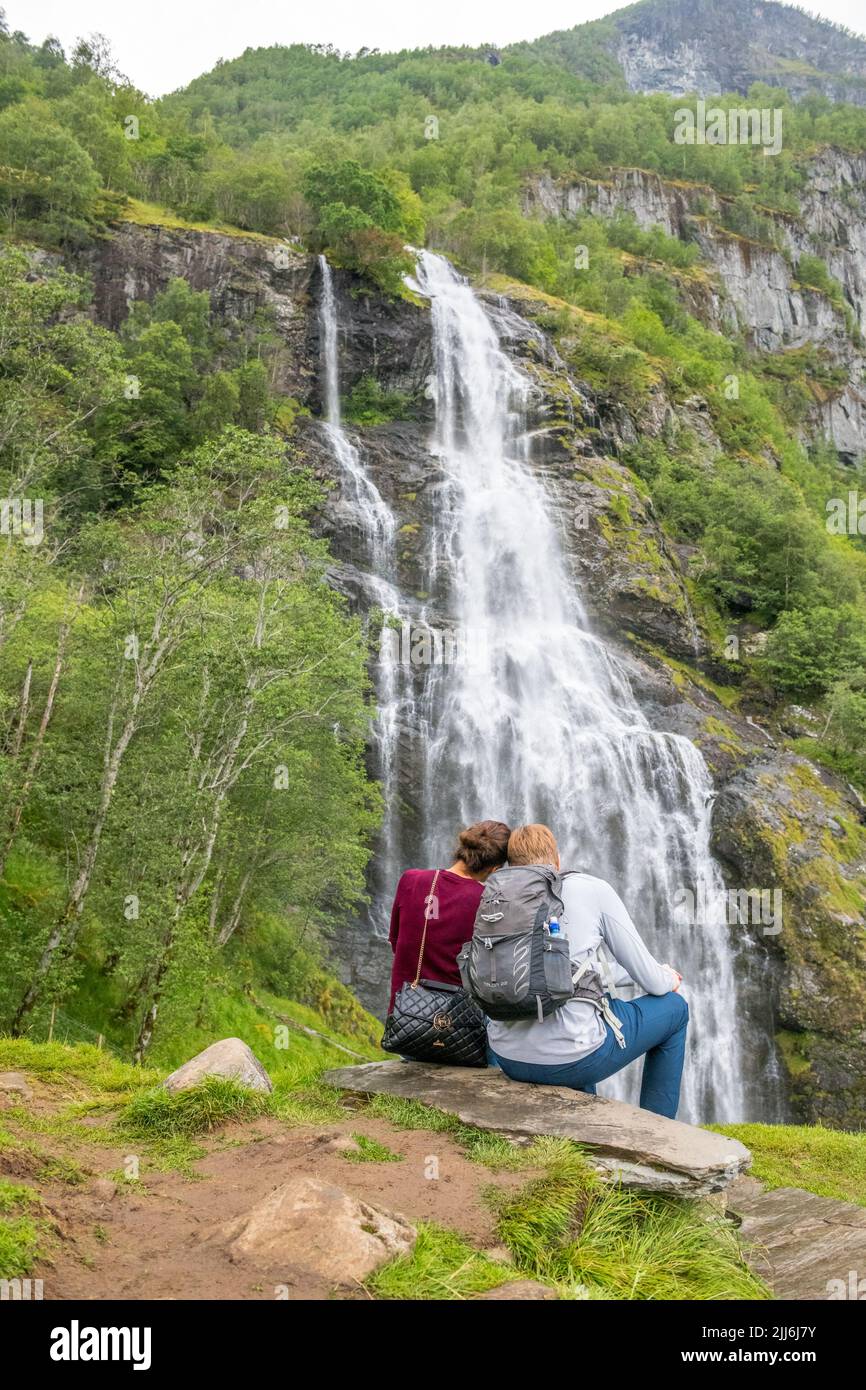 Tourists at the Brekkefossen waterfall, near Flam in Norway Stock Photo